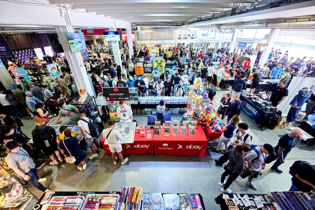 Crowds browsing trading card vendor tables at the London Card Show.