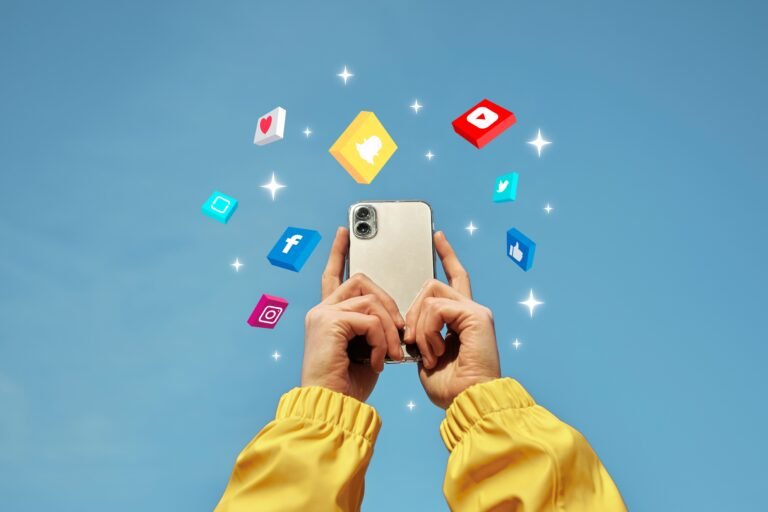 Phone being held in the sky with social media icons around it