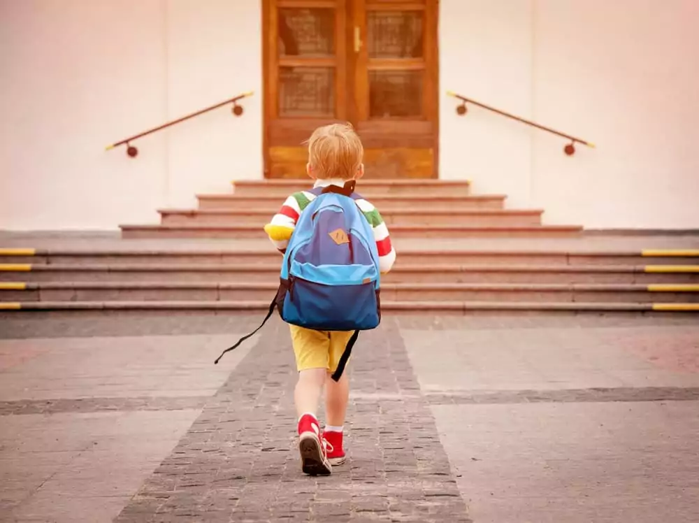 Child walking to school alone, depicting how adults digital footprint exposes a child